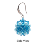 Side view of blue crystal and aquamarine pearl cluster earring showing 3D ball shape and silver ear wire