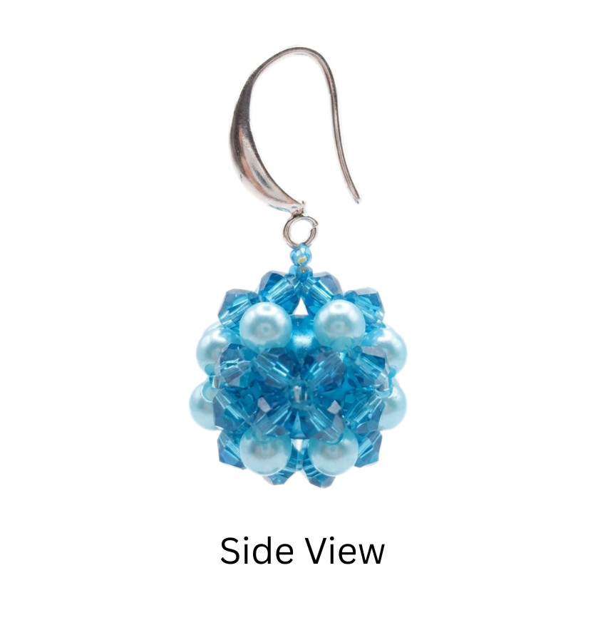 Side view of blue crystal and aquamarine pearl cluster earring showing 3D ball shape and silver ear wire