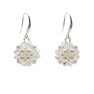 Handmade crystal and white pearl drop earrings with silver hooks on white background