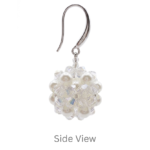 Side view of handmade crystal and pearl cluster earring showing 3D ball shape and silver ear wire