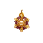 Crystal and pearl pendant with a champagne centre pearl surrounded by warm champagne faceted crystals and an outer purple crystals, accented throughout with gold beads, displayed against a white background.