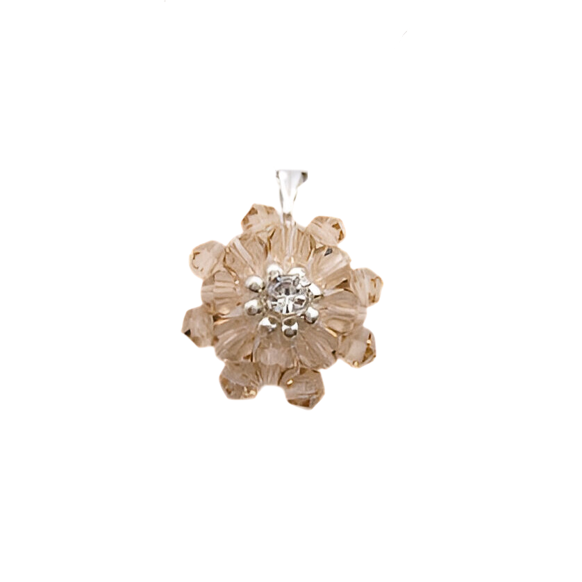 cubic-zirconia-pendant-main Handmade champagne crystal flower pendant with two layers of warm golden-pink faceted crystals and a sparkling cubic zirconia centre, photographed on a white background.