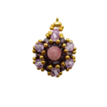 Handmade pink tourmaline pendant featuring a smooth round pink tourmaline centre stone surrounded by deep violet and light purple faceted crystals with gold bead accents and a gold-tone bail, photographed on a white background.