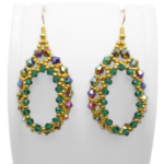 Emerald green and gold beaded teardrop hoop earrings displayed on a white jewellery stand, featuring iridescent rainbow crystals and gold seed beads with gold-tone ear wires.