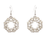 Handmade open hoop drop earrings featuring woven white faux pearl beads and silver-tone accent beads in a circular lattice design, with silver-tone fish hook ear wires — flat lay view