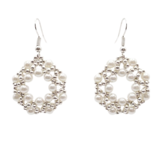 Handmade open hoop drop earrings featuring woven white faux pearl beads and silver-tone accent beads in a circular lattice design, with silver-tone fish hook ear wires — flat lay view