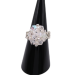 Handmade clear AB crystal cluster cocktail ring on black cone ring stand — iridescent aurora borealis crystals and silver-tone seed beads, handcrafted statement ring