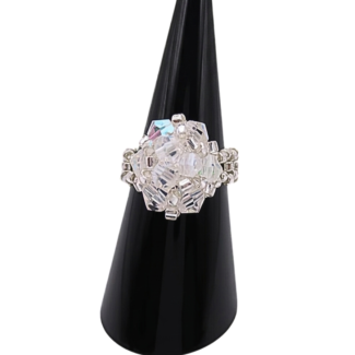 Handmade clear AB crystal cluster cocktail ring on black cone ring stand — iridescent aurora borealis crystals and silver-tone seed beads, handcrafted statement ring