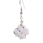 Close-up of single handmade clear aurora borealis iridescent crystal beaded drop earring with white pearl accent and silver ear wire on white background