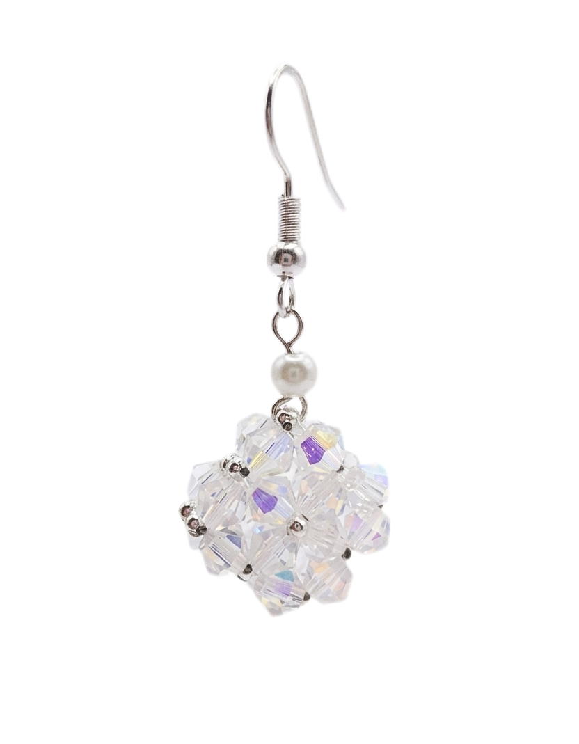 Close-up of single handmade clear aurora borealis iridescent crystal beaded drop earring with white pearl accent and silver ear wire on white background