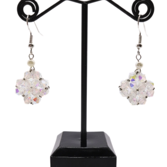 Handmade clear aurora borealis crystal beaded earrings with white pearl accent displayed on black jewellery stand, double-layered iridescent crystal pendant with silver ear wire