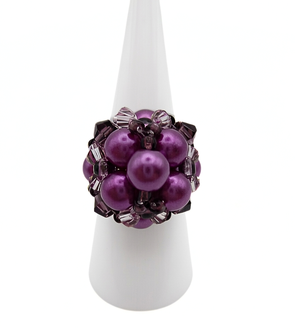 pearl-cocktail-ring-purple-main Purple pearl cluster cocktail ring with violet crystal accents displayed on white ring cone stand - handmade beaded statement ring