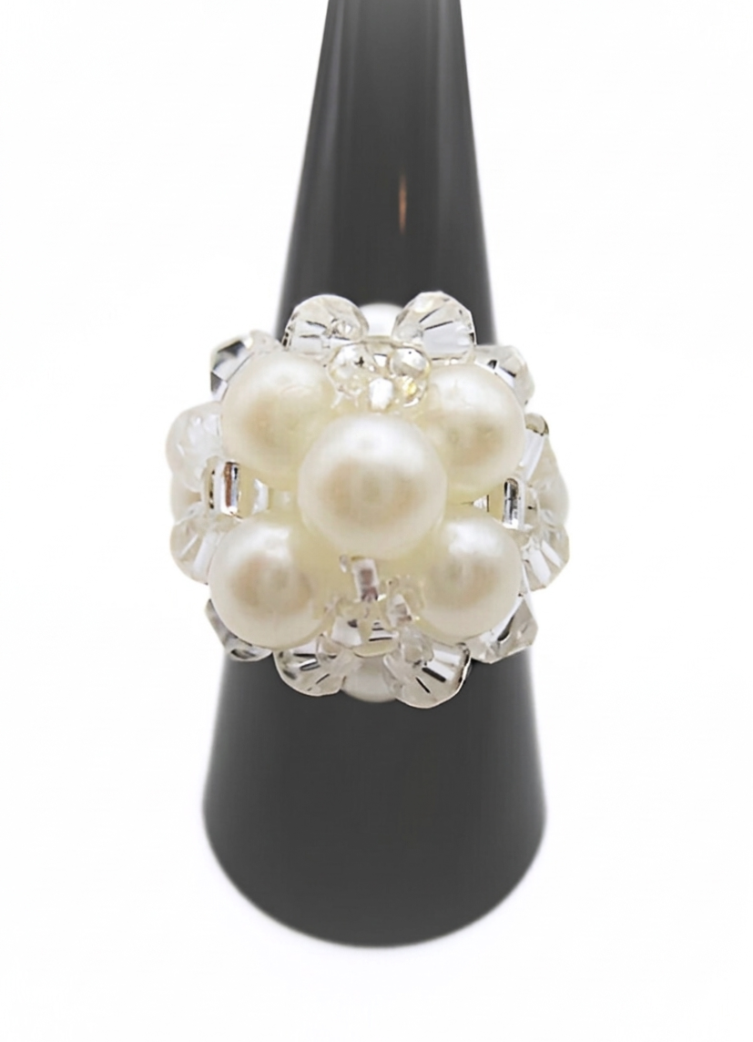 pearl-cocktail-ring-white-main White pearl cluster cocktail ring with clear crystal accents displayed on black ring cone stand - handmade beaded statement ring