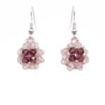 Handmade pink and purple crystal drop earrings with silver-tone hooks, beaded floral ball dangle design, shown against a white background.