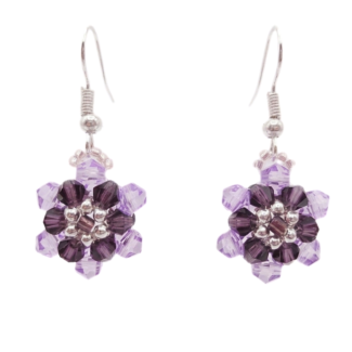 Purple and lilac crystal floral drop earrings with silver-tone hooks and bead accents on a white background