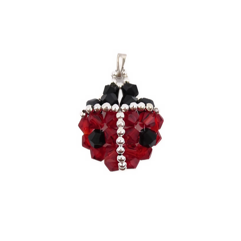 Handmade ladybug-shaped pendant featuring vivid red and black faceted crystals with a silver bead spine and border detailing, black crystal head and a silver-tone bail, photographed on a white background.
