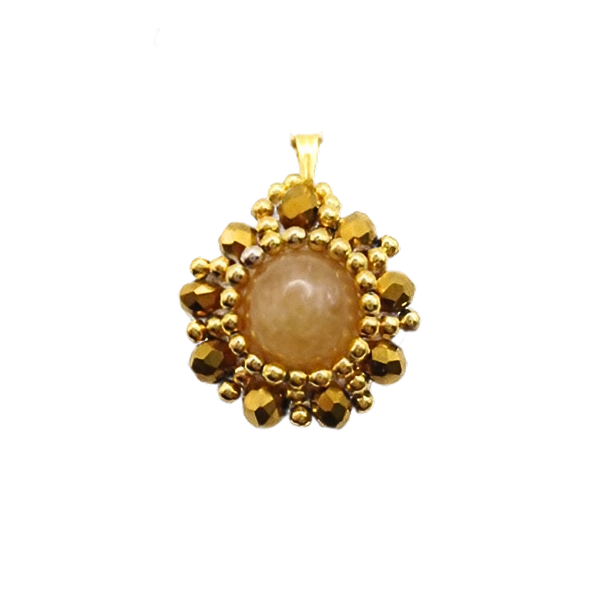 Handmade reversible tourmaline pendant front view featuring a smooth round peach tourmaline centre stone encircled by metallic gold-plated faceted crystals and gold bead accents in a sunburst floral design, with a gold-tone bail, photographed against a white background.