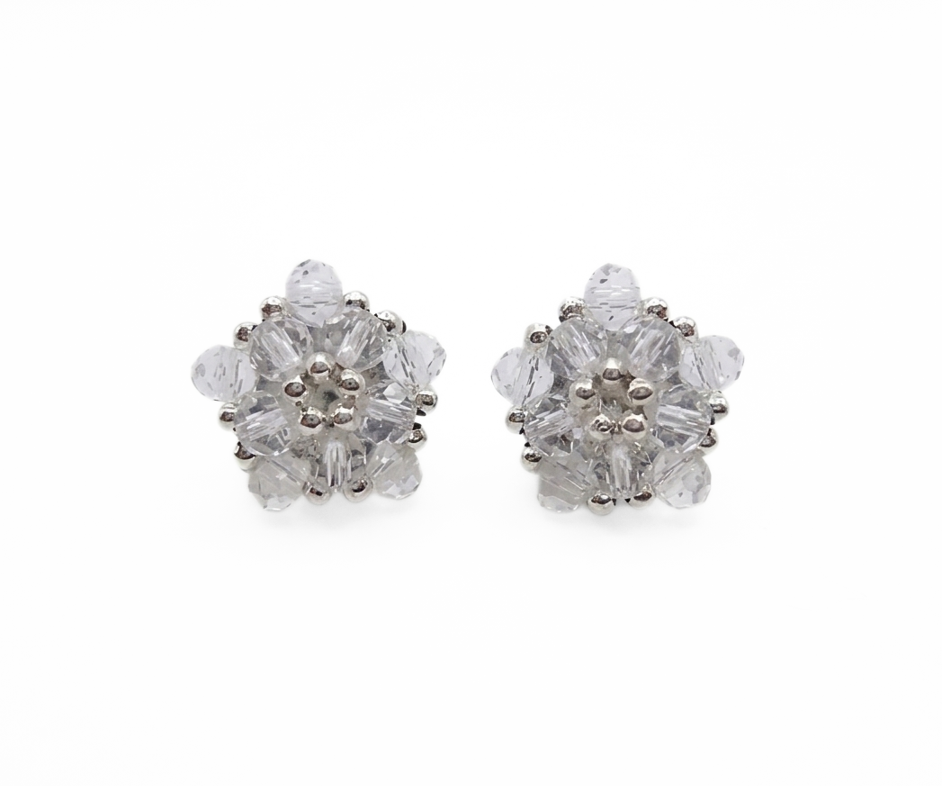 Clear crystal cluster stud earrings with silver-tone accents, handmade star-inspired pentagon design, shown against a white background