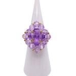 Medium handmade lavender purple crystal cocktail ring on white cone display stand - beaded cluster ring with gold accent beads and a hidden large crystal centre