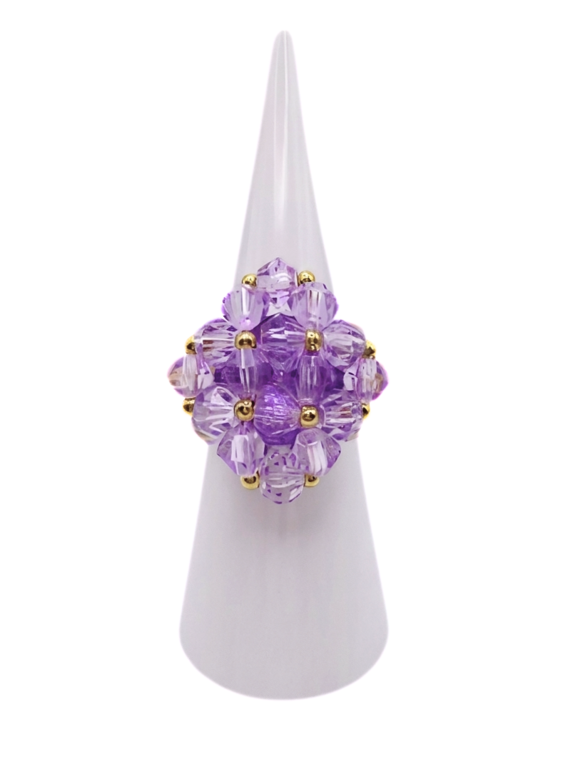 medium-champange-cocktail-ring-display Medium handmade lavender purple crystal cocktail ring on white cone display stand - beaded cluster ring with gold accent beads and a hidden large crystal centre