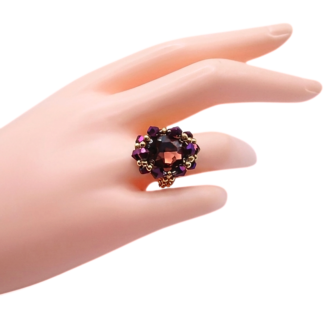 Purple crystal and gold-tone cocktail ring worn on mannequin hand - handmade beaded statement ring
