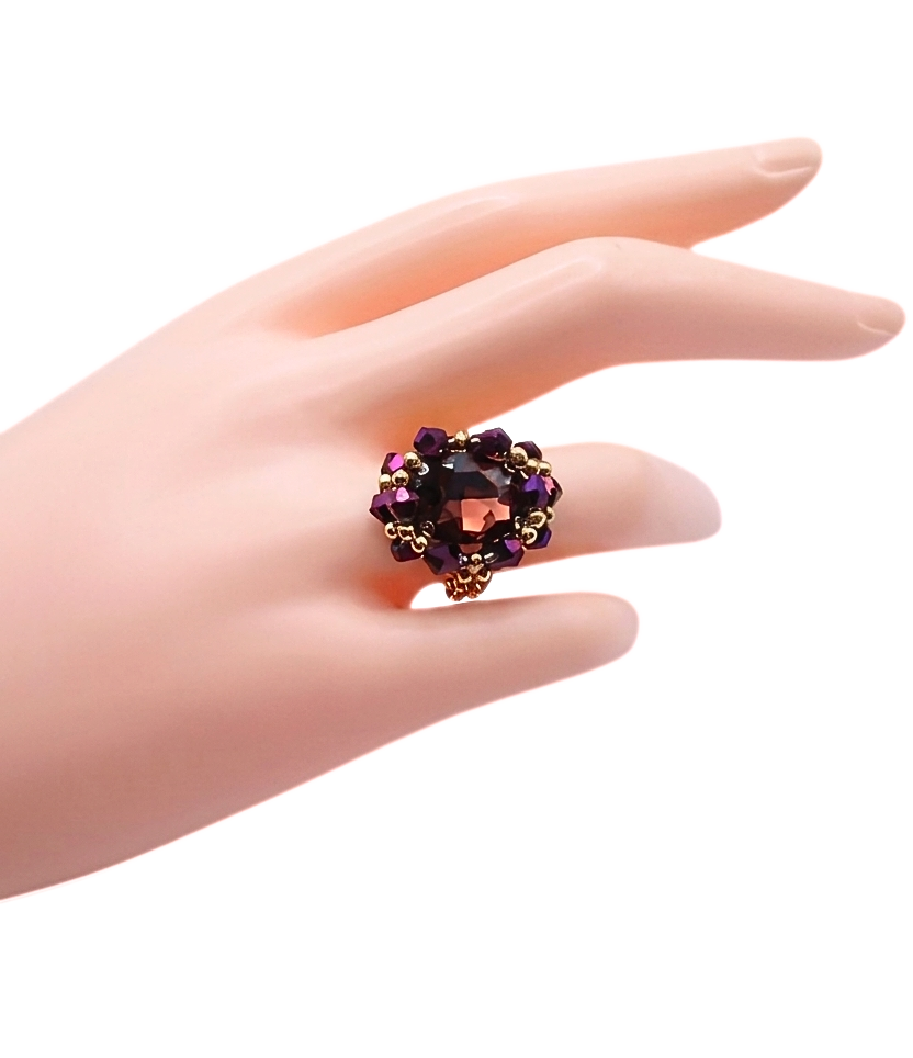 Purple crystal and gold-tone cocktail ring worn on mannequin hand - handmade beaded statement ring