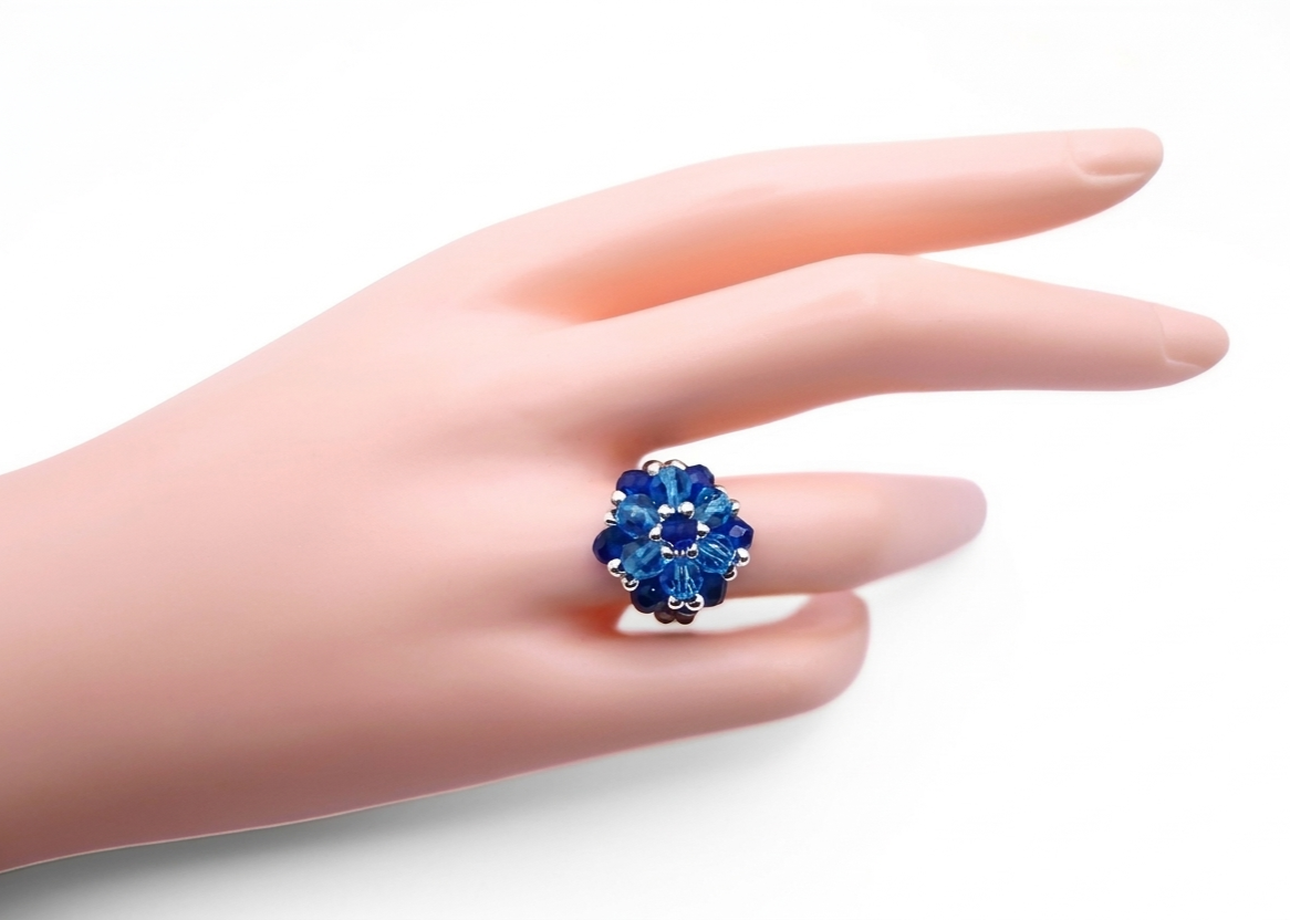 Sapphire blue and aquamarine crystal cluster ring worn on a mannequin hand, showcasing size and fit - handmade statement cocktail ring with silver-tone accents