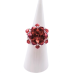 Red crystal cluster cocktail ring with large center crystal on white ring cone stand — handmade beaded statement ring