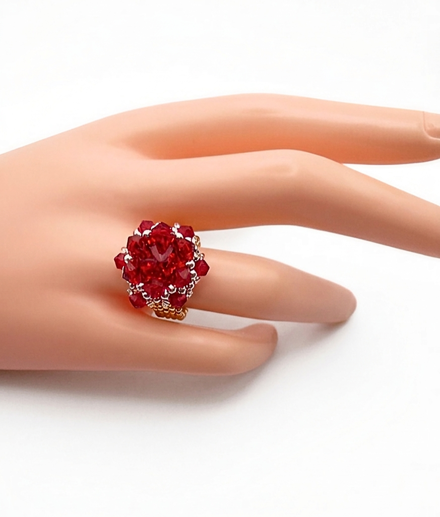 red-cocktail-ring-wrist-display Red crystal cluster cocktail ring worn on mannequin hand showing size and scale --handmade beaded ruby red statement ring
