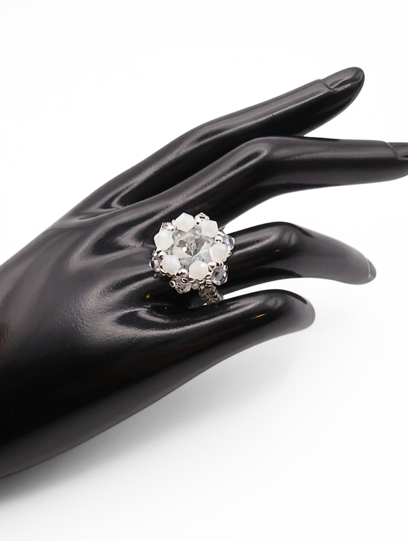 white-cocktail-ring-wrist-display Clear crystal and opaque white crystal cocktail ring worn on a black mannequin hand, showing fit and scale - handmade beaded bridal statement ring