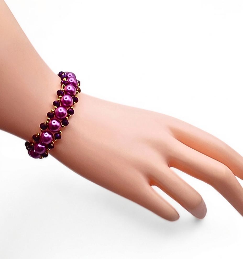 Handcrafted purple pearl & metallic purple crystal bracelet - large lustrous purple pearls and deep metallic purple faceted crystals woven together with gold seed bead accents in a bold, full cluster design. A vibrant, feminine artisan statement bracelet.