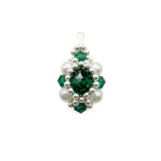 Handmade emerald green crystal pendant with ivory pearls and silver beads on a white background