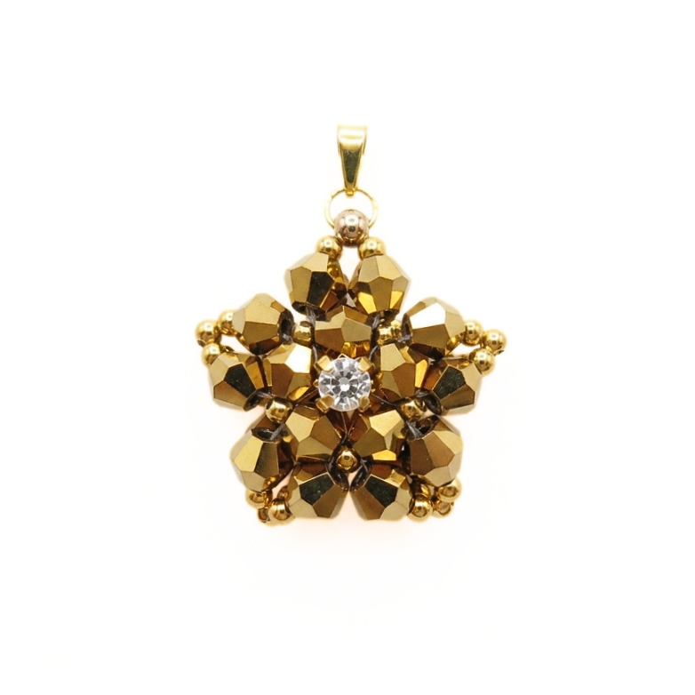 Intricate gold-coloured crystal pendant featuring faceted crystals arranged in a star-pattern with gold accents and a sparkling cubic zirconia centre, shown against a white background.