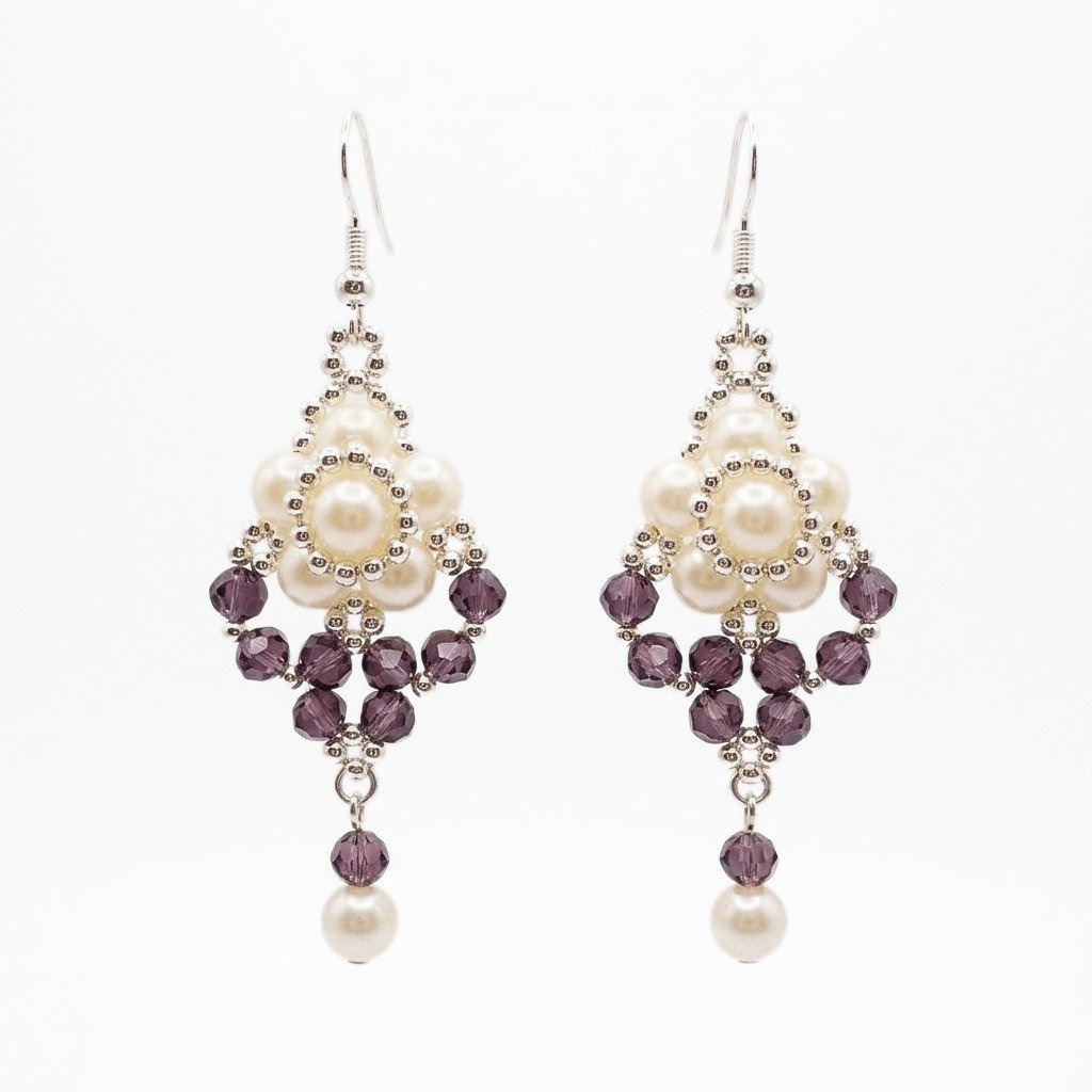 amethyst-crystal-pearl-earrings Off-white pearl and amethyst purple crystal drop earrings with faceted purple crystals, silver-toned bead detailing and dangling pearl accents.