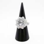 Handmade statement ring featuring a large clear crystal surrounded by faceted aurora borealis crystals and white pearls