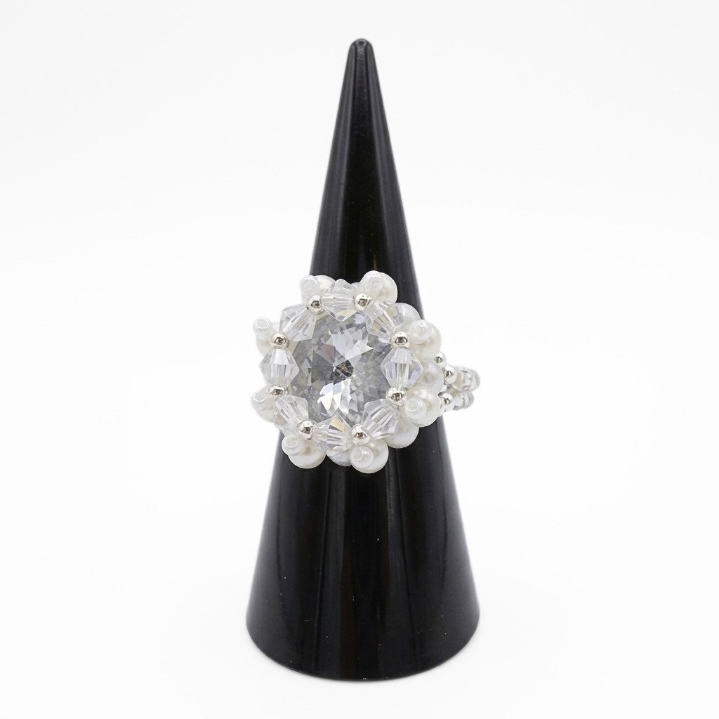 crystal-pearl-statement-ring-angled-view Handmade statement ring featuring a large clear crystal surrounded by faceted aurora borealis crystals and white pearls