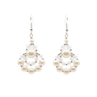 Clear crystal and off-white faux pearl drop earrings with silver-tone detailing, handmade statement pearl earrings on a white background