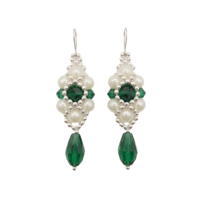 A thumbnail image of handcrafted drop earrings made with deep emerald green crystals, white pearl beads, and silver accents hanging against a plain background.