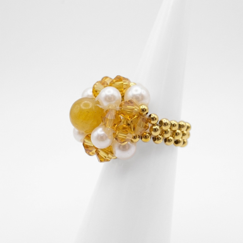 golden-tourmaline-ring-side-view A side view of a cocktail ring with golden faceted crystals, cream pearls and golden tourmaline centre bead, handcrafted statement jewellery