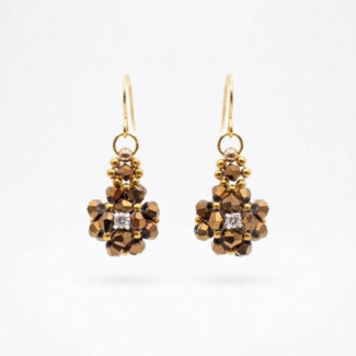 Metallic bronze crystal cluster earrings with sparkling cubic zirconia centre, and gold-tone ear wires on a neutral background
