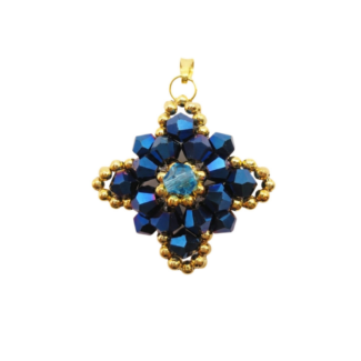 Navy blue crystal pendant with metallic blue crystals, aquamarine-coloured centre crystal, and gold-coloured bead accents. Shown against a white background.