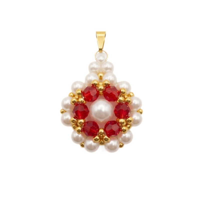 Handcrafted flower pendant with white pearls, red crystal beads, and gold-tone bail on a white background.