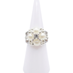 Handmade statement ring featuring faux pearls, grey crystal beads, and a center rhinestone, shown against a white background