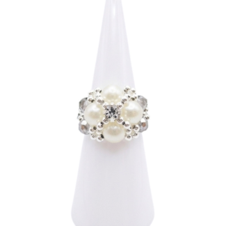 Handmade statement ring featuring faux pearls, grey crystal beads, and a center rhinestone, shown against a white background