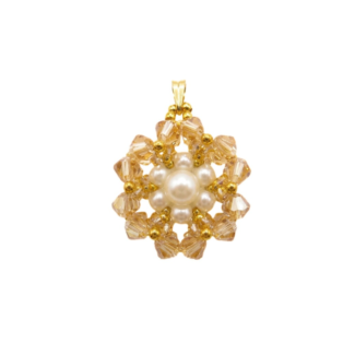 Golden crystal and pearl flower pendant necklace with gold accents on gold curb chain, shown against a white background